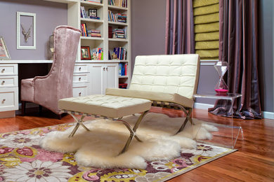 Mid-sized trendy built-in desk dark wood floor and brown floor study room photo in St Louis with purple walls