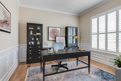 Example of a transitional home office design in Raleigh