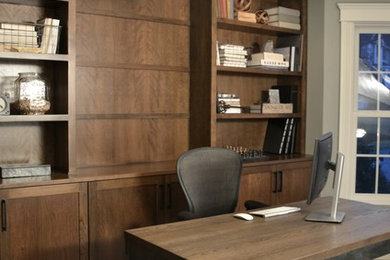 Example of a transitional home office design in Boston