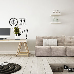 Esempio di un ufficio minimalista di medie dimensioni con pareti bianche, pavimento in laminato, nessun camino, cornice del camino in intonaco, scrivania autoportante e pavimento grigio