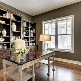 Example of a transitional home office design in Minneapolis