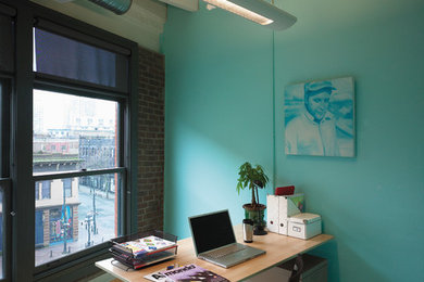 Example of a trendy home office design in Montreal