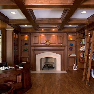 Home office in natural cherry with coffered ceiling and open bookcases