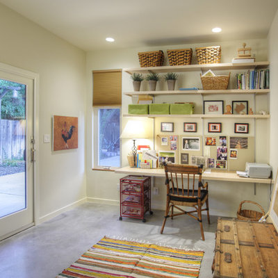 Mid-sized trendy built-in desk concrete floor and gray floor home office photo in Sacramento with white walls and no fireplace