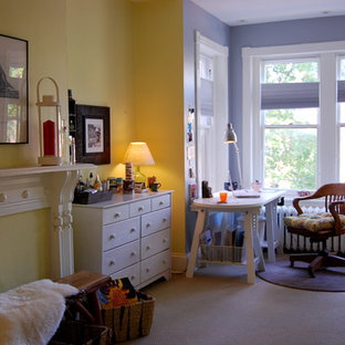 Home office - eclectic freestanding desk carpeted home office idea in DC Metro with yellow walls