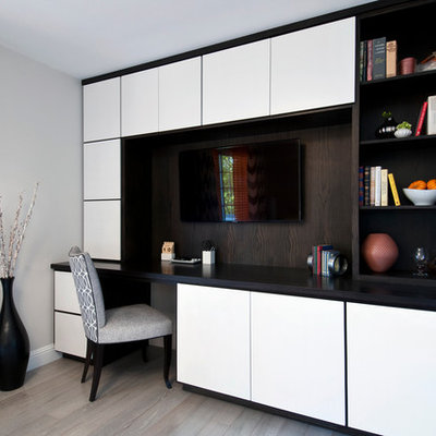 Inspiration for a mid-sized contemporary built-in desk light wood floor study room remodel in San Francisco with gray walls and no fireplace