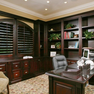 Large elegant built-in desk carpeted study room photo in San Diego with yellow walls and no fireplace