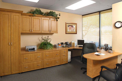 Photo of a large classic home office in Seattle with beige walls, carpet and a built-in desk.