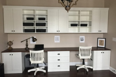 Inspiration for a transitional built-in desk dark wood floor home office remodel in Charlotte