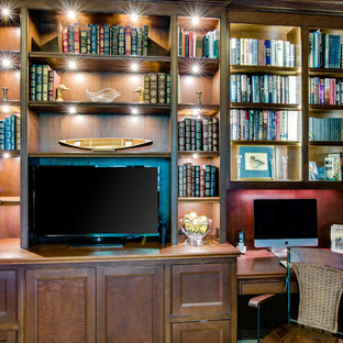 Home office - built-in desk carpeted home office idea in Miami with no fireplace