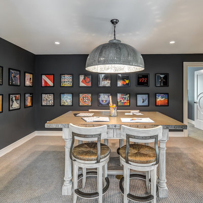 Example of a huge urban freestanding desk carpeted and beige floor home studio design in Cincinnati with black walls and no fireplace