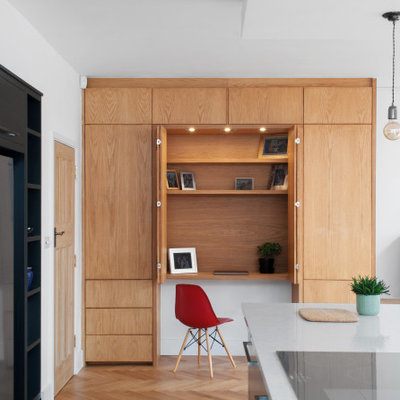 Study room - small contemporary built-in desk light wood floor and beige floor study room idea in London with white walls and no fireplace