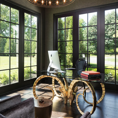 Example of a tuscan freestanding desk dark wood floor and brown floor study room design in Minneapolis