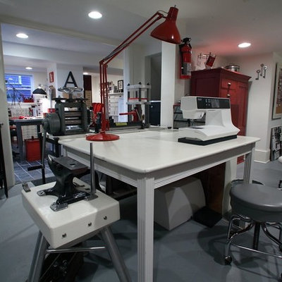 Huge urban freestanding desk concrete floor home studio photo in Portland with white walls and no fireplace