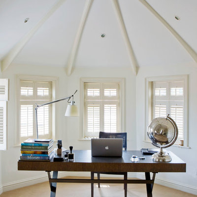 Inspiration for a timeless freestanding desk carpeted home office remodel in Other with white walls