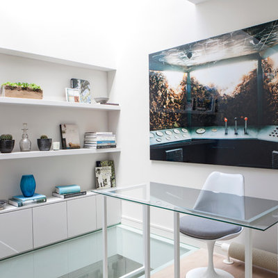 Inspiration for a contemporary freestanding desk study room remodel in London with white walls