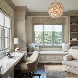 Study room - traditional built-in desk dark wood floor study room idea in Chicago with white walls and no fireplace