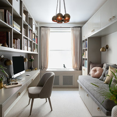 Small trendy built-in desk carpeted study room photo in New York with white walls and no fireplace