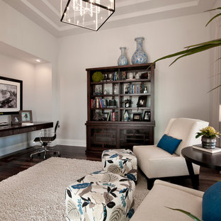 Example of a trendy freestanding desk dark wood floor home office design in Tampa with gray walls