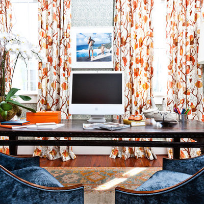 Example of an eclectic freestanding desk medium tone wood floor home office design in Charleston