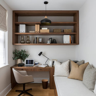 Inspiration for a traditional study in Buckinghamshire with white walls, medium hardwood flooring, no fireplace and a freestanding desk.