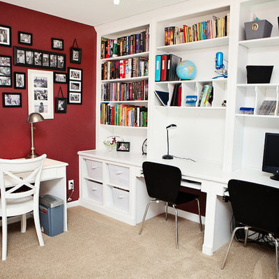 Inspiration for a mid-sized transitional built-in desk carpeted and brown floor home office remodel in Raleigh with red walls and no fireplace