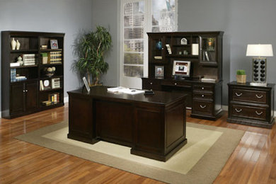 Inspiration for a freestanding desk medium tone wood floor home office remodel in Phoenix with gray walls