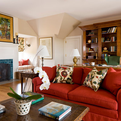 Example of a large classic freestanding desk medium tone wood floor and brown floor study room design in Charleston with a tile fireplace, beige walls and a standard fireplace