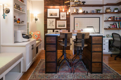 Trendy medium tone wood floor and brown floor study room photo in Atlanta with gray walls