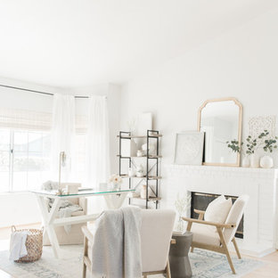 Inspiration för mellanstora shabby chic-inspirerade hemmabibliotek, med vita väggar, ljust trägolv, en standard öppen spis, en spiselkrans i tegelsten, ett fristående skrivbord och beiget golv
