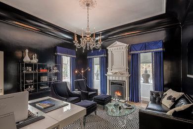 Inspiration for a large eclectic home office remodel in Chicago with black walls and a standard fireplace