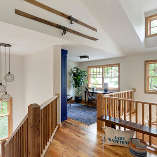 Study room - coastal freestanding desk medium tone wood floor study room idea in Minneapolis with white walls and no fireplace