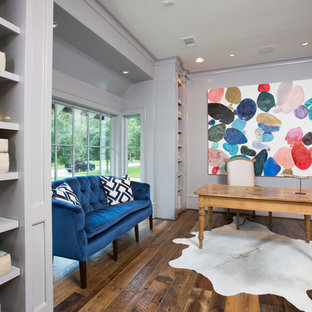 Photo of a large traditional study in Houston with purple walls, dark hardwood flooring, a freestanding desk and no fireplace.