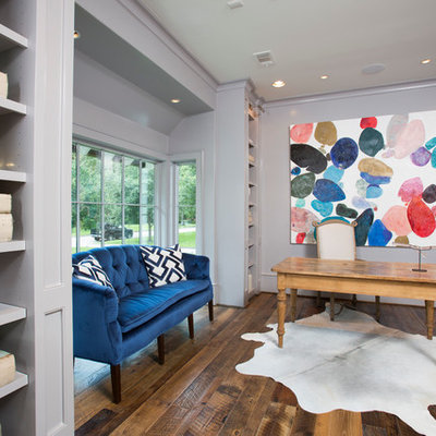 Study room - large transitional freestanding desk dark wood floor study room idea in Houston with no fireplace and gray walls