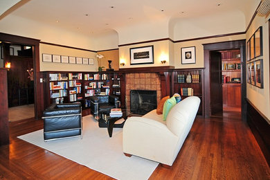 Home office library - mid-sized craftsman dark wood floor and brown floor home office library idea in San Francisco with beige walls, a standard fireplace and a tile fireplace