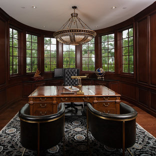 Study room - large traditional freestanding desk brown floor and dark wood floor study room idea in Chicago with brown walls and no fireplace