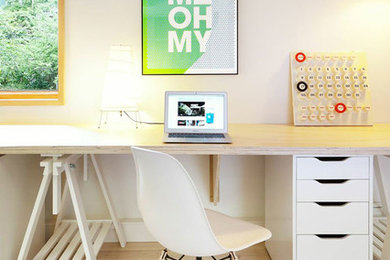 Example of a mid-century modern home office design in Vancouver