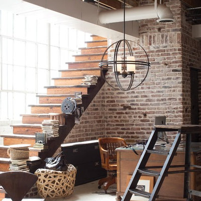 Inspiration for a large industrial freestanding desk concrete floor home studio remodel in Austin with no fireplace
