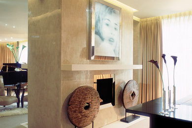 Study room - large contemporary freestanding desk carpeted study room idea in Houston with beige walls, a standard fireplace and a stone fireplace