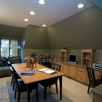 Lower level home office with clipped walls painted in a lovely sage green