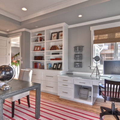 Example of a classic built-in desk home office design in Los Angeles