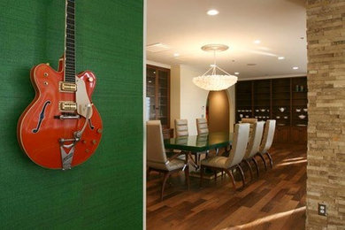 Example of an eclectic medium tone wood floor study room design in Nashville with green walls