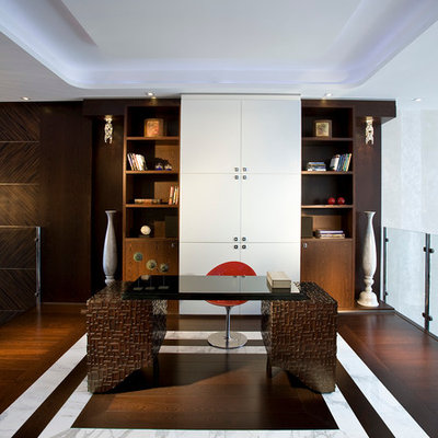 Inspiration for a large contemporary freestanding desk dark wood floor and multicolored floor study room remodel in Miami with white walls