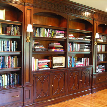 Mahogany library cabinetry with carved mouldings