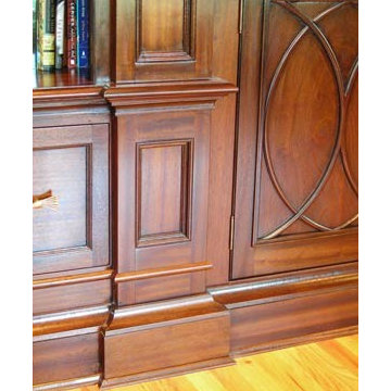 Mahogany library cabinetry with carved mouldings