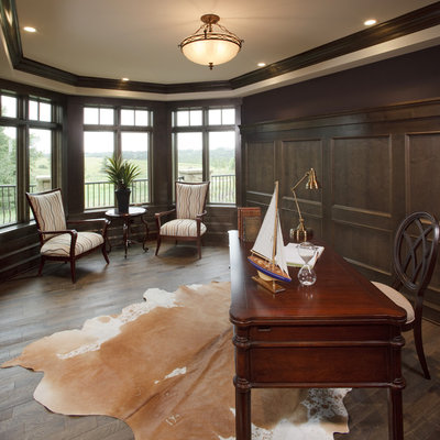 Elegant freestanding desk dark wood floor home office photo in Calgary