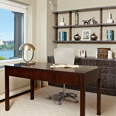 Study room - large transitional freestanding desk light wood floor study room idea in New York with beige walls and no fireplace