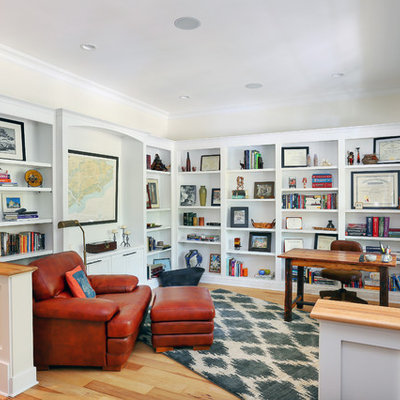 Inspiration for a mid-sized timeless freestanding desk medium tone wood floor study room remodel in Charleston with beige walls