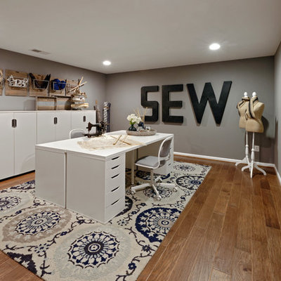Example of a large transitional freestanding desk vinyl floor and brown floor craft room design in DC Metro with gray walls and no fireplace