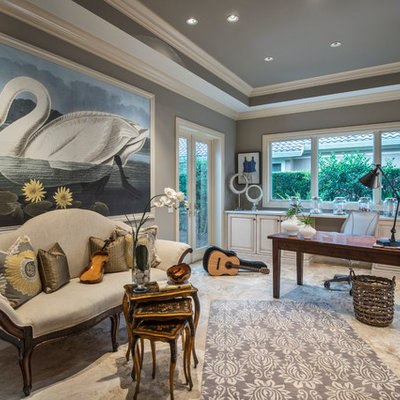 Mid-sized tuscan freestanding desk beige floor and porcelain tile home office photo in Miami with gray walls and no fireplace